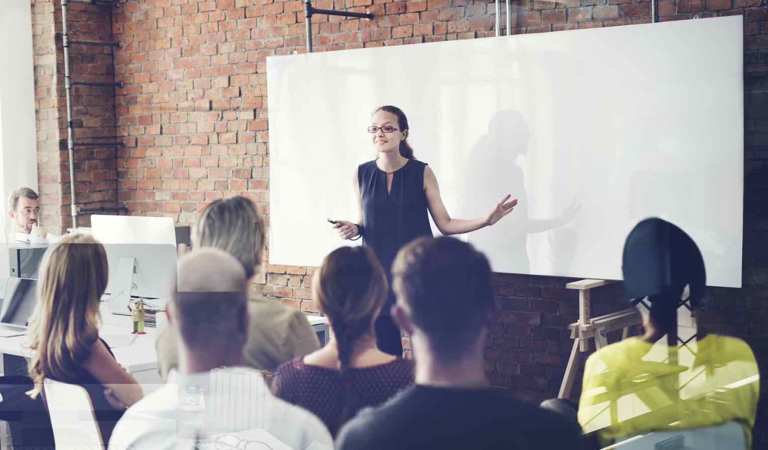 Woman speaking in front of group