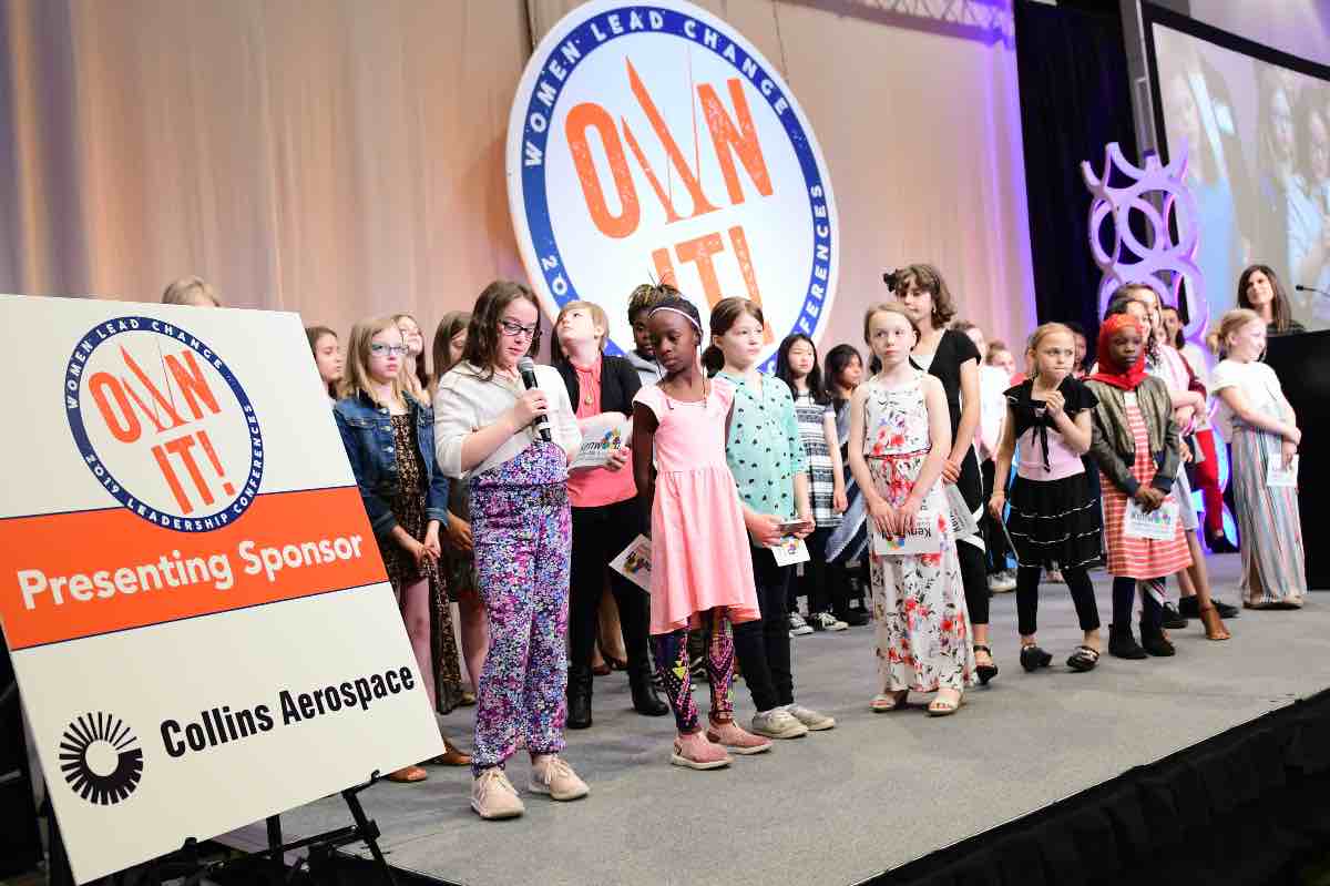 Students talking on stage