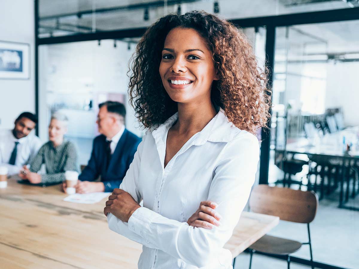 A confident business woman looks at the camera